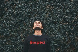 Man in sweatshirt that says 'Respect', symbolising self-respect